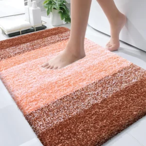 Orange microfiber bathroom rug 30x20 with quick-dry non-slip backing.